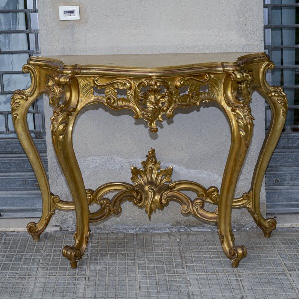 consolle in legno intagliato e dorato a foglia oro piano sagomato in marmo 