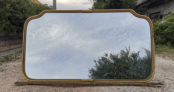 Specchio in legno dorato sagomato epoca 1950